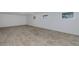 Spacious finished basement with tile flooring, recessed lighting, and bright windows at 3150 Trident Ter, New Port Richey, FL 34652