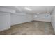 Finished basement with recessed lighting, tile flooring and access to additional rooms at 3150 Trident Ter, New Port Richey, FL 34652