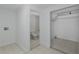 A view inside showing a laundry area, a bathroom with a toilet and shower/tub, and an storage area at 3150 Trident Ter, New Port Richey, FL 34652