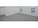 Bedroom features carpet floors and multiple windows offering lots of natural light at 3150 Trident Ter, New Port Richey, FL 34652