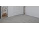 Spacious bedroom with closet and carpeted floors at 3150 Trident Ter, New Port Richey, FL 34652