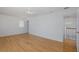 Bedroom with hardwood flooring, a window and an open doorway to a hallway at 3150 Trident Ter, New Port Richey, FL 34652