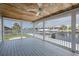 The spacious, screened-in deck offers beautiful views of the canal and outdoor living at its finest at 3150 Trident Ter, New Port Richey, FL 34652