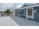 Spacious deck with sliding glass doors providing an open indoor-outdoor feel, overlooking the beautiful backyard canal at 3150 Trident Ter, New Port Richey, FL 34652