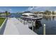 A modern yacht is docked at a private pier, highlighting waterfront luxury at 3150 Trident Ter, New Port Richey, FL 34652