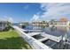 Waterfront with dock featuring boat lift access, providing luxurious living and convenient boating in a scenic community at 3150 Trident Ter, New Port Richey, FL 34652