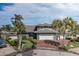 Beautiful two-story home featuring a brick driveway, lush landscaping, and a two-car garage at 3150 Trident Ter, New Port Richey, FL 34652
