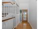 Bright entryway with hardwood floors, staircase, and decorative front door at 3150 Trident Ter, New Port Richey, FL 34652