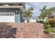 Attached two-car garage with long brick driveway and mature landscaping at 3150 Trident Ter, New Port Richey, FL 34652