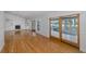 Spacious living room featuring hardwood floors, a fireplace, and waterfront views at 3150 Trident Ter, New Port Richey, FL 34652