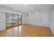 Spacious living room featuring hardwood floors and sliding glass doors at 3150 Trident Ter, New Port Richey, FL 34652