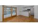 Open-concept living space with hardwood floors connects to a modern kitchen with waterfront views at 3150 Trident Ter, New Port Richey, FL 34652
