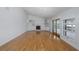 Bright living room featuring hardwood floors, fireplace and water view at 3150 Trident Ter, New Port Richey, FL 34652