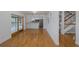 Spacious living room with hardwood floors that open to a modern kitchen at 3150 Trident Ter, New Port Richey, FL 34652