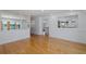 Bright living room with light hardwood floors and large windows at 3150 Trident Ter, New Port Richey, FL 34652