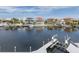 Waterfront scene with multiple docks and boat lifts showcasing luxury waterfront living and serene neighborhood vibes at 3150 Trident Ter, New Port Richey, FL 34652
