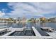 Beautiful waterfront view showing multiple docks, boat lifts, and luxurious homes in a picturesque neighborhood at 3150 Trident Ter, New Port Richey, FL 34652
