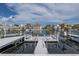 A panoramic view of a waterfront showing docks with boat lifts in a residential neighborhood on a sunny day at 3150 Trident Ter, New Port Richey, FL 34652