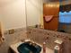 Bathroom featuring a blue sink, tile countertop, and ornate fixtures at 3206 Pinon Dr, Holiday, FL 34691
