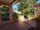 Covered patio area provides a perfect spot for outdoor dining and entertaining at 3206 Pinon Dr, Holiday, FL 34691