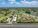 Wide aerial shot highlighting the community's golf course, lakes, and proximity to the highway, offering beautiful views at 3317 Abigail Ct, New Port Richey, FL 34655