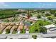 An aerial shot with an arrow pointing to the home's location in a neighborhood with a golf course in the distance at 3317 Abigail Ct, New Port Richey, FL 34655