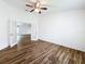 Bedroom features wood-look floors, and a double French door entry to the adjacent room at 3317 Abigail Ct, New Port Richey, FL 34655