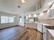 Kitchen and dining area featuring tile floors, white appliances, and neutral paint at 3317 Abigail Ct, New Port Richey, FL 34655