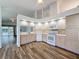 Kitchen area featuring tile floors, white appliances, and neutral paint at 3317 Abigail Ct, New Port Richey, FL 34655
