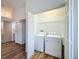 Bright laundry room with a side-by-side washer and dryer in a closet at 3317 Abigail Ct, New Port Richey, FL 34655