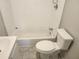 Bathroom with tiled walls, a standard tub, and a modern toilet at 3415 N 51St St, Tampa, FL 33619