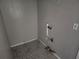 The laundry room offers connections for plumbing and electricity and ceramic tile floors at 3415 N 51St St, Tampa, FL 33619