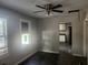 Cozy living room with hardwood floors and plenty of natural light at 3415 N 51St St, Tampa, FL 33619