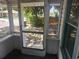 Enclosed porch featuring screens and a clear view of the exterior landscape at 3415 N 51St St, Tampa, FL 33619