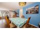 Cozy dining area with stylish light fixture and charming wall art at 3841 Lanyard Ct # B, New Port Richey, FL 34652