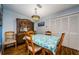 Bright dining room features traditional wood furniture with natural lighting at 3841 Lanyard Ct # B, New Port Richey, FL 34652