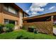 Exterior view of condo featuring carport, and manicured lawn at 3841 Lanyard Ct # B, New Port Richey, FL 34652