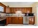 Well-appointed kitchen featuring tiled countertops, stainless steel appliances, and tile backsplash at 3841 Lanyard Ct # B, New Port Richey, FL 34652