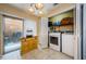 Laundry area with washer, dryer, storage, and sliding glass door to exterior at 3841 Lanyard Ct # B, New Port Richey, FL 34652