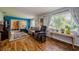 Bright living room with wood flooring, neutral walls, and large windows at 3841 Lanyard Ct # B, New Port Richey, FL 34652