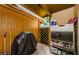 Enclosed outdoor patio featuring grill, door to exterior, and storage at 3841 Lanyard Ct # B, New Port Richey, FL 34652