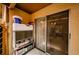 Enclosed patio with sliding glass doors showcases outdoor storage solutions at 3841 Lanyard Ct # B, New Port Richey, FL 34652