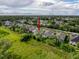 Aerial view of a home with a manicured yard, set amongst various homes in a suburban neighborhood at 4082 Watson Dr, New Port Richey, FL 34655