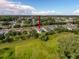 Aerial view featuring a home amidst lush greenery in a peaceful suburban neighborhood at 4082 Watson Dr, New Port Richey, FL 34655