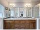 Bathroom featuring a double vanity, granite countertop, tile flooring and a glass enclosed shower at 4082 Watson Dr, New Port Richey, FL 34655