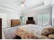 The light and bright bedroom includes window shutters, wood look floors, and neutral walls at 4082 Watson Dr, New Port Richey, FL 34655