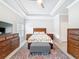 This spacious bedroom features tray ceilings, neutral paint, and wood furnishings at 4082 Watson Dr, New Port Richey, FL 34655