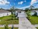 Attractive exterior view of the house, highlighting its architectural details, manicured lawn, and curb appeal at 4082 Watson Dr, New Port Richey, FL 34655