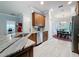 Granite countertops accent the kitchen space with stainless dishwasher and nearby dining area at 4082 Watson Dr, New Port Richey, FL 34655