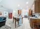 Bright kitchen features granite counters, stainless appliances, and an open layout to living area at 4082 Watson Dr, New Port Richey, FL 34655